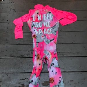 Neon pink, glow in the dark onesie with hoodie.